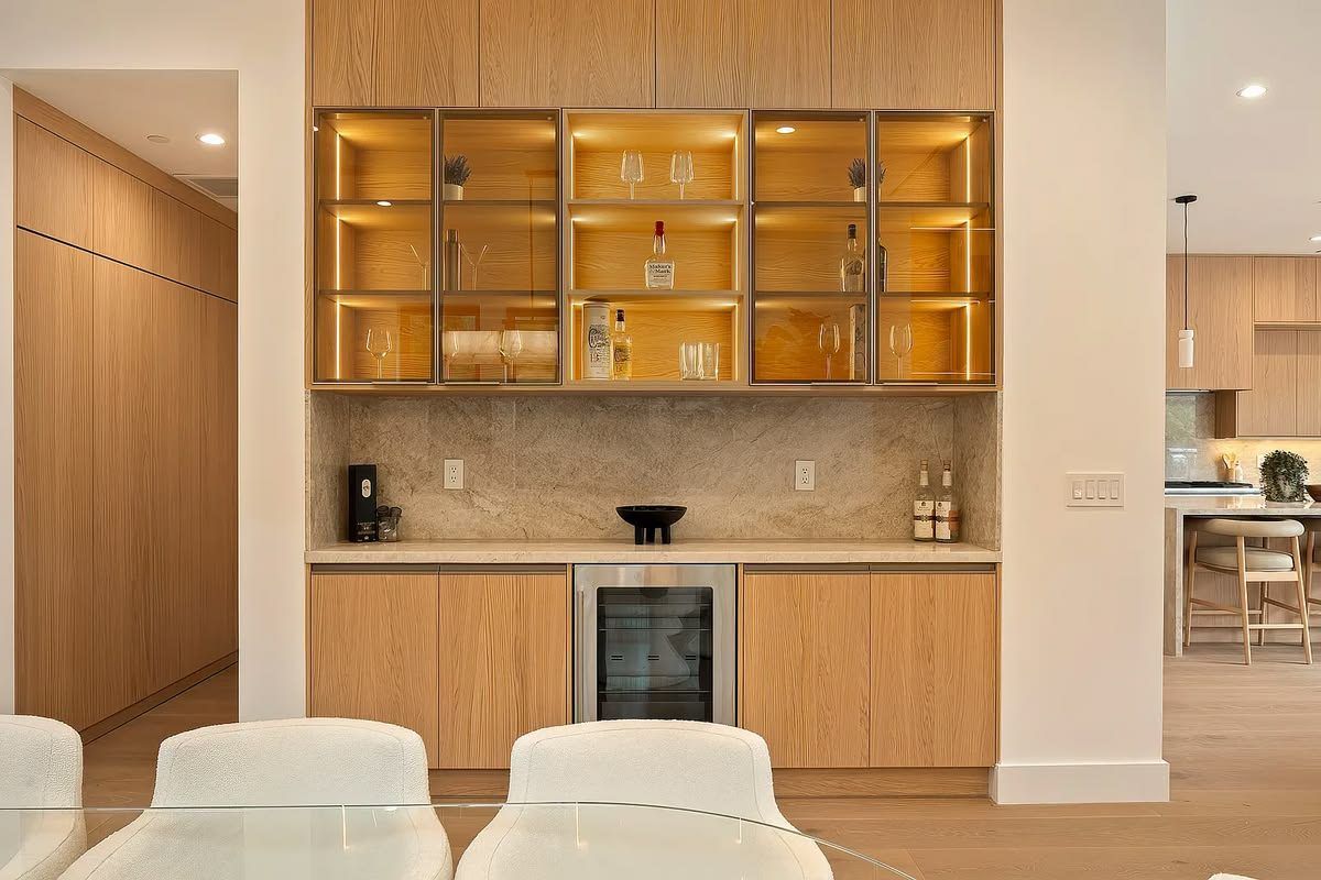 Butler's bar with backlit glass display cabinets