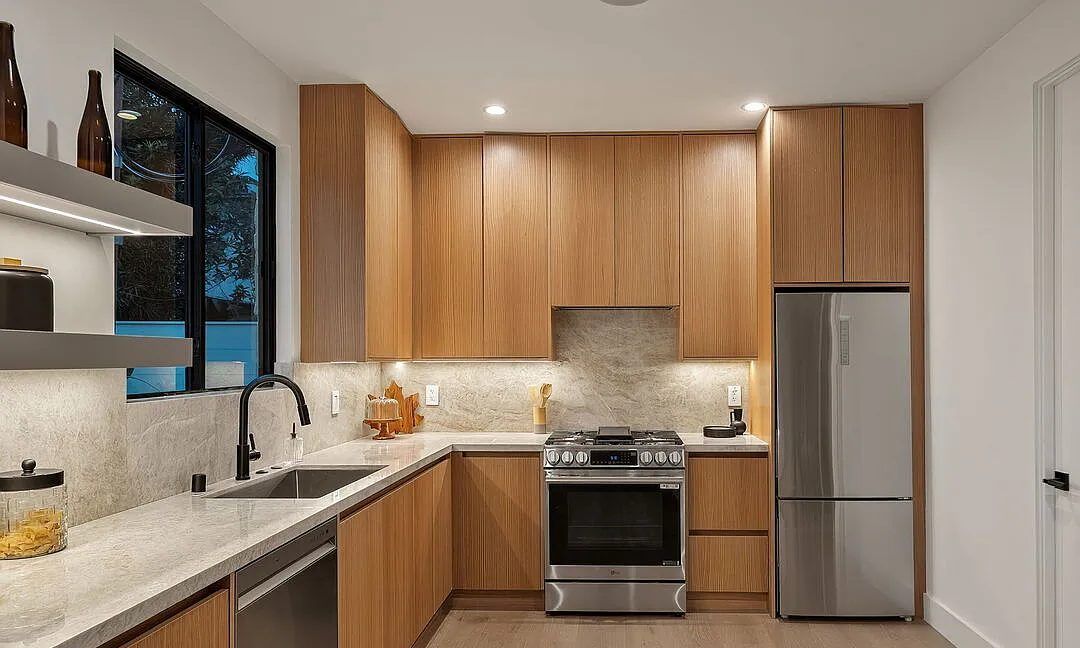 White oak kitchen with stone backsplash and island